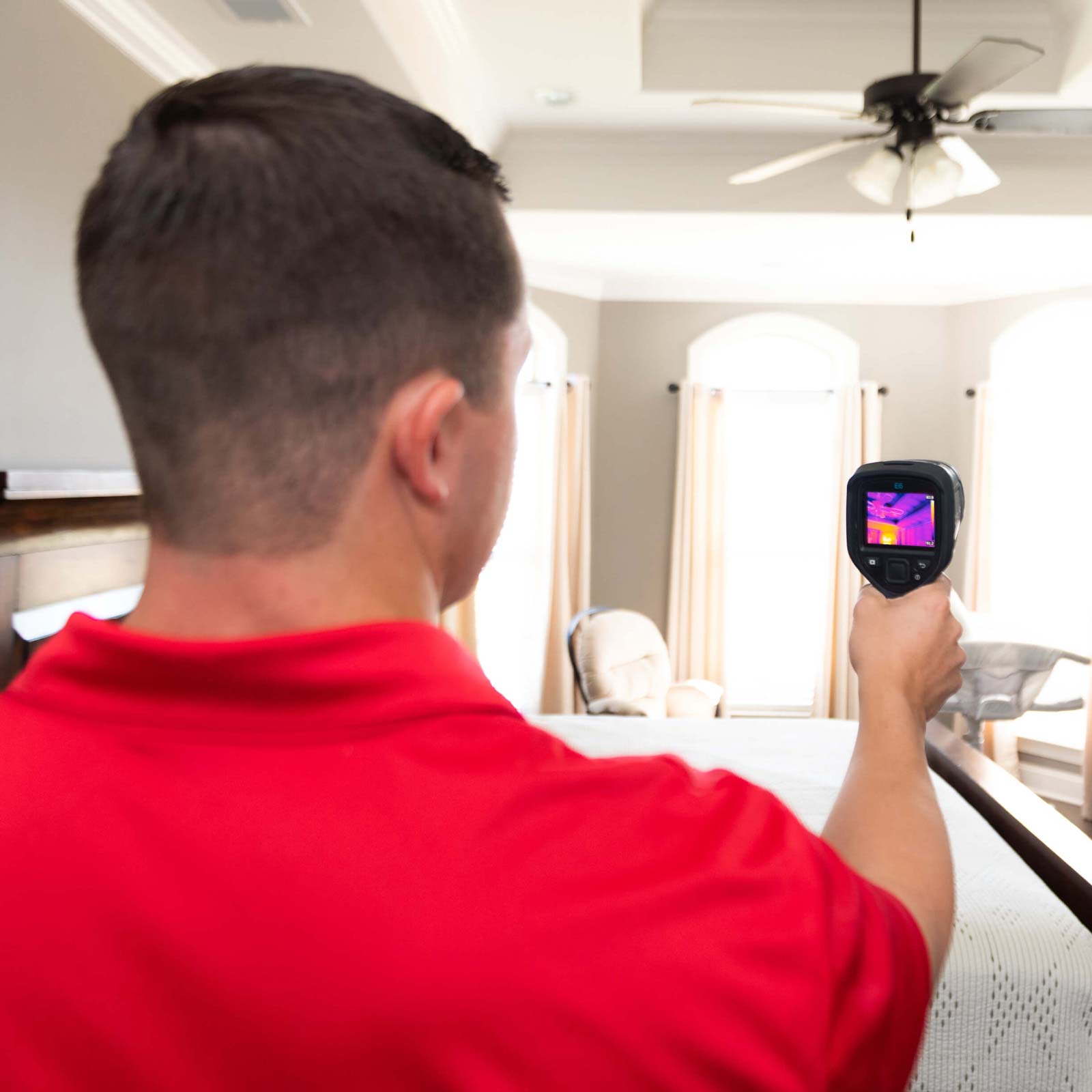 Home Inspector Colin Wilson using thermal imaging to assist in home inspection 